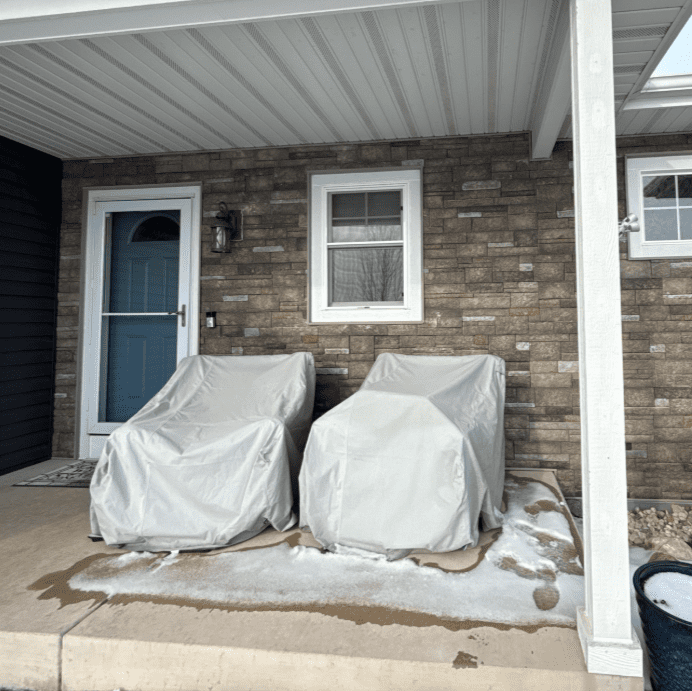 After photo of the Versetta Stone accent section on an Oconomowoc, WI home with new Prem Pointe siding and updated trim, completed by Modern Exterior.