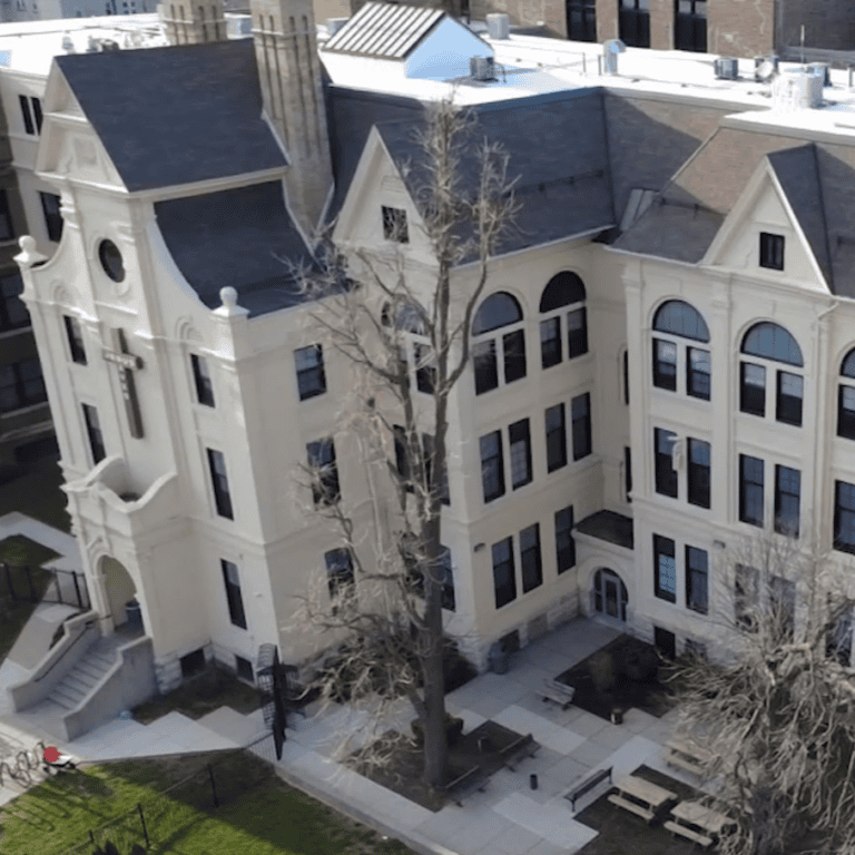 Aerial view of multiple steep-slope shingle roof sections before a large-scale commercial roof replacement in Milwaukee.