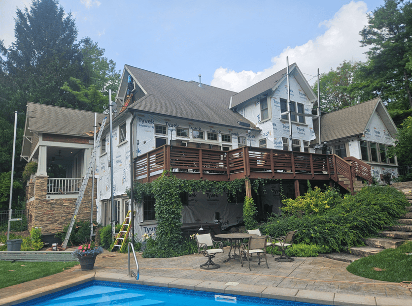 Modern Exterior crew installing new siding and house wrap on a Wisconsin home